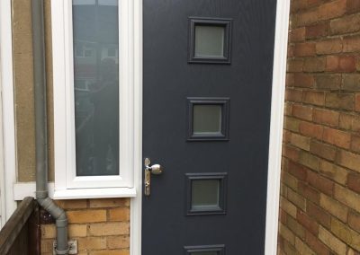 Grey door with side and top glass