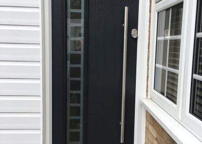 grey composite door with bar handle and etched square glass